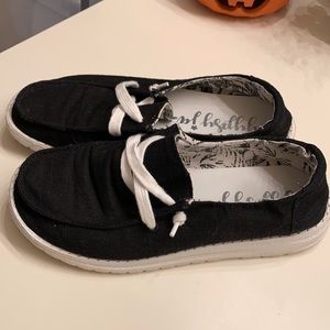 Black slip on comfortable shoes.